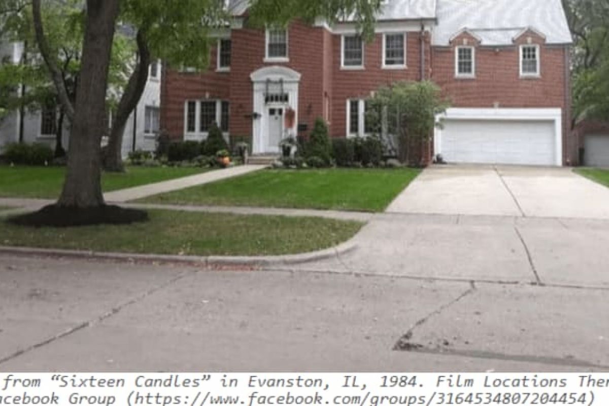Optima Verdana luxury apartment with Red-brick house with white trim and two-car garage, nestled among trees—a hidden gem on a North Shore tour.
