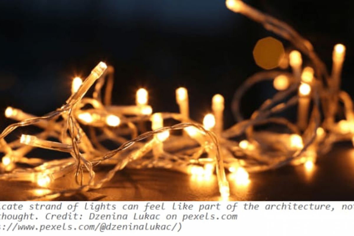 Optima Verdana luxury apartment with A string of small warm white fairy lights glows softly against a dark, blurred background—perfect for modernist interiors or holiday decorating.