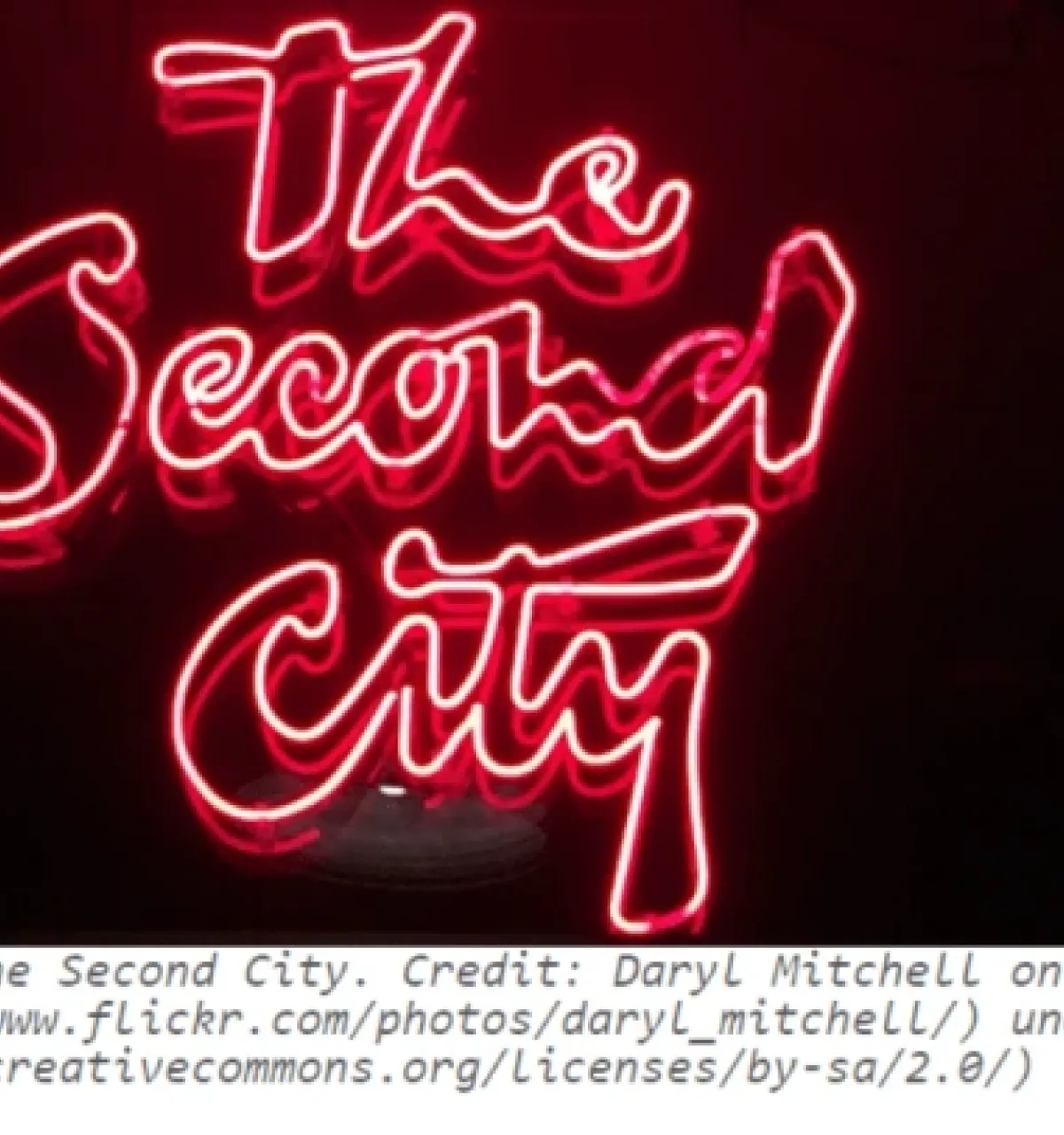 Optima Verdana luxury apartment with Neon pink "The Second City" logo glowing against a black background, celebrating the history of the iconic Chicago comedy club. Optima Verdana luxury apartment with Neon pink "The Second City" logo glowing against a black background, celebrating the history of the iconic Chicago comedy club.