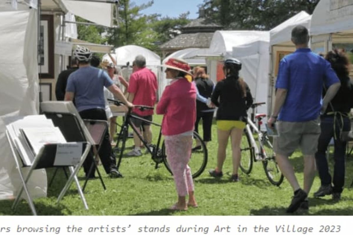 Optima Verdana luxury apartment with People walk and browse outdoor artists' booths at Art in the Village, celebrating creativity and community on a sunny day.