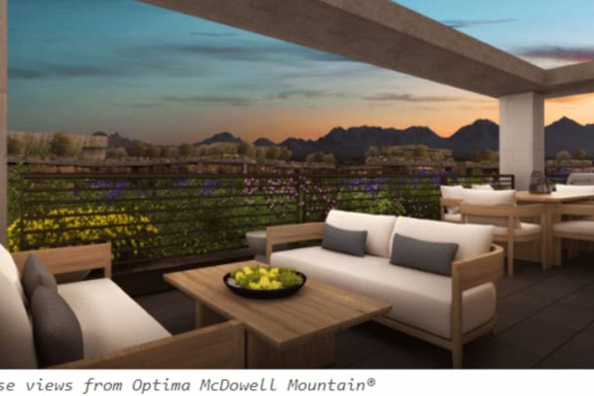 Optima Verdana luxury apartment with Modern patio with cushioned seating overlooks mountains and flowers at sunrise, embracing Optima Lifestyle and Wellderliness.
