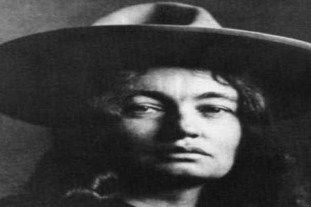 Optima Verdana luxury apartment with Black and white portrait of Mary Hunter Austin, part of the Great Writers Series, wearing a wide-brimmed hat and looking directly at the camera.