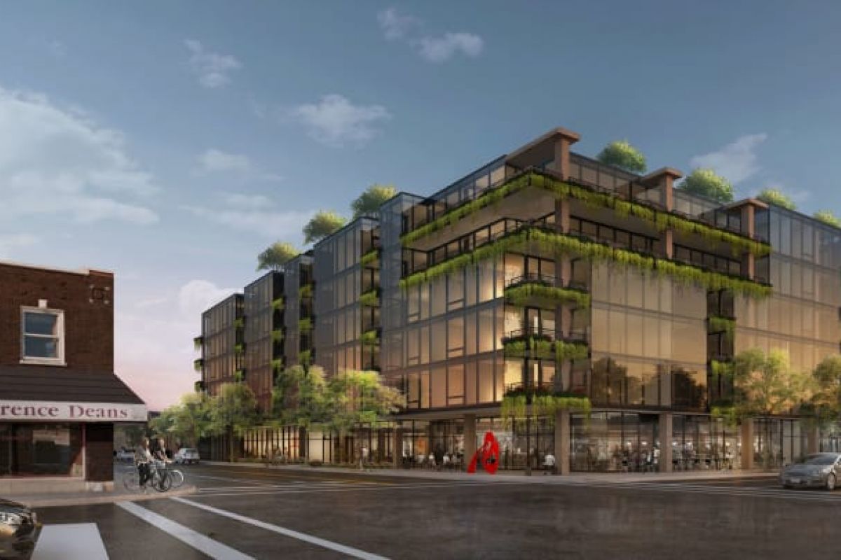 Optima Verdana luxury apartment with Modern glass building, featuring Optima Verdana typeface on balconies with greenery, stands by "Lawrence Deans" brick storefront at dusk.