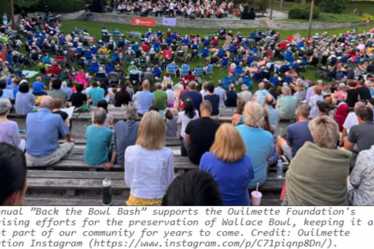 Optima Verdana luxury apartment with A large crowd sits outdoors at Wilmette's amphitheater, enjoying a stage concert amid trees—a true local legacy event.
