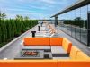 Optima Verdana luxury apartment with Modern rooftop patio for Optima Residents with orange seating, fire pit, and lounge chairs—choose to relax with sky views.