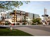 Optima Verdana luxury apartment with Modern glass building behind a railroad crossing, highlighting how sleep quality can be shaped by your home environment.